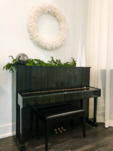 evolve christmas wreath and piano