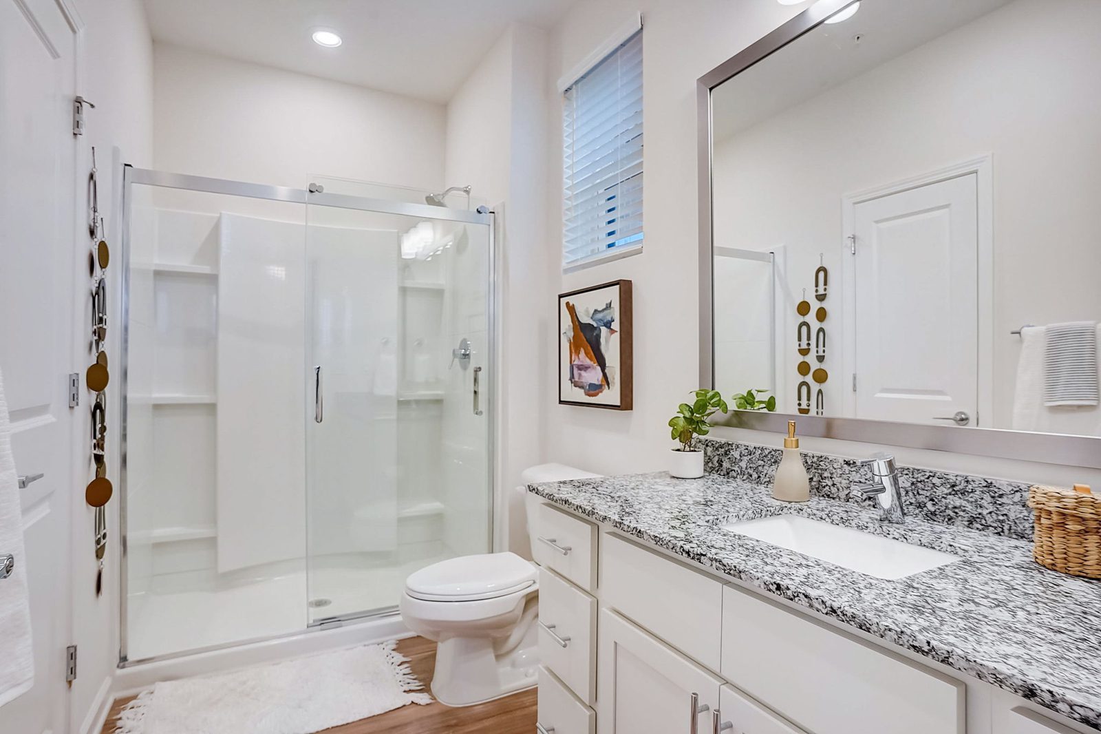 Evolve Lake Norman bathroom with quartz counters and glass shower