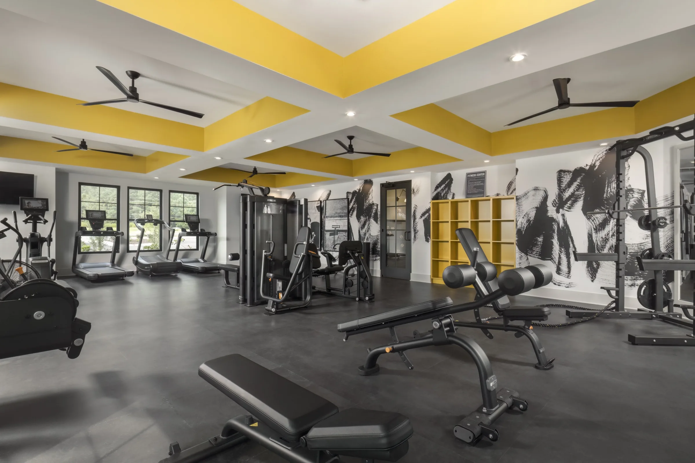 Evolve at the Pines fitness center with yellow ceiling