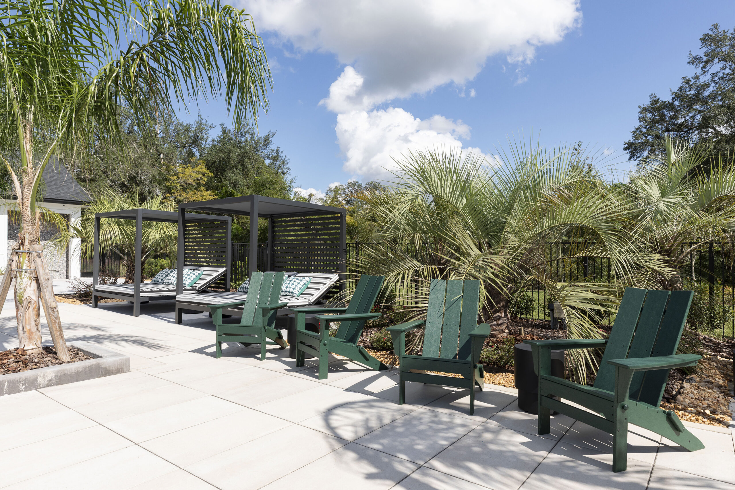 Evolve Grove Park pool deck chairs and palm trees